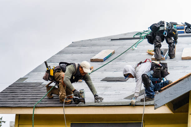 Professional Gutter Installation technician working in Lincoln, MA